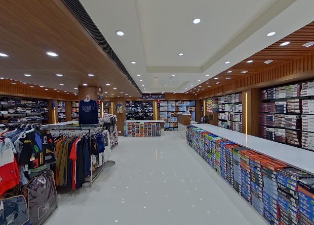 Interior view of ASRITHA FASHION MALL showing clothing displays in Lakshmipuram, Guntur